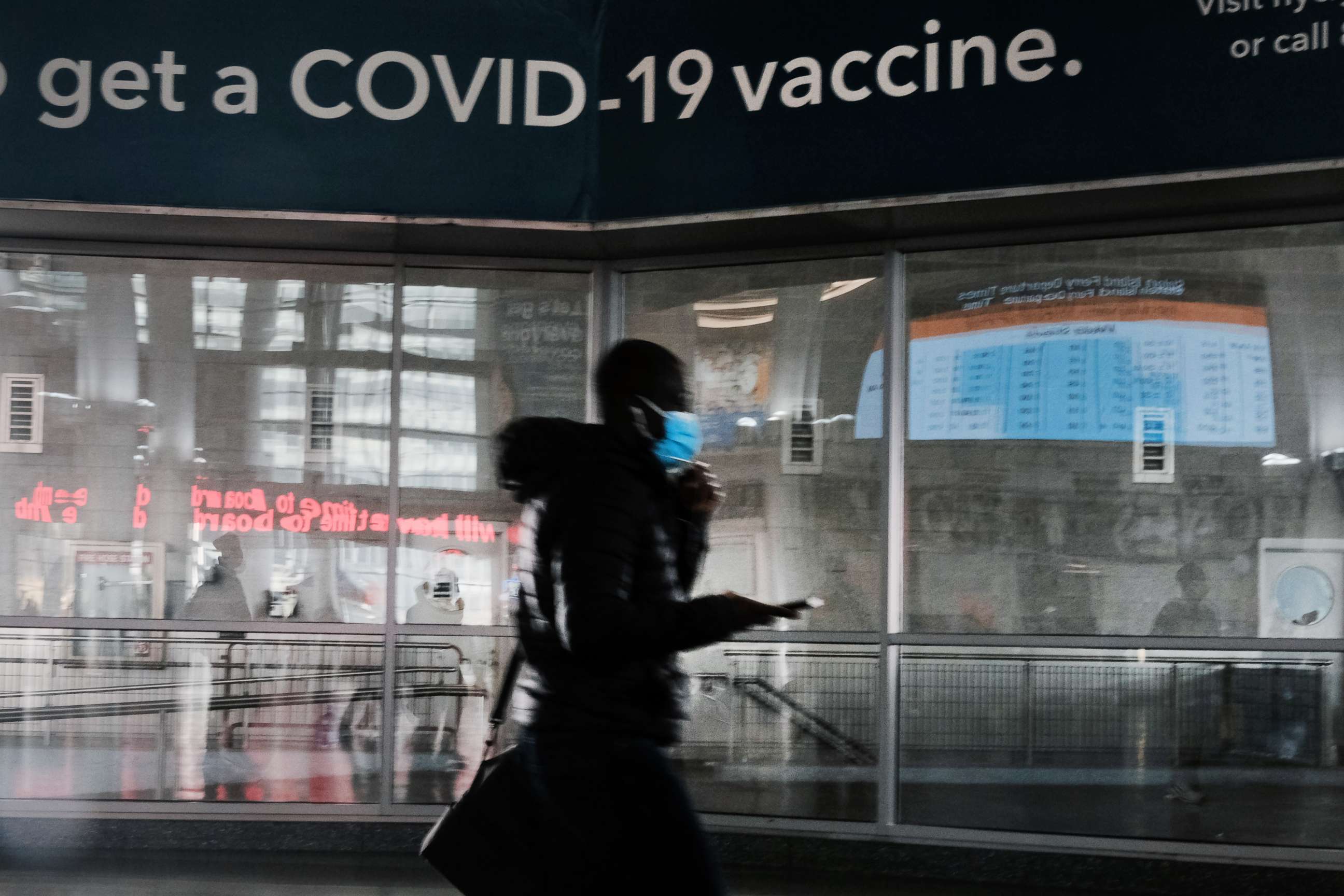 PHOTO: A sign urges people to get the COVID-19 vaccine at the Staten Island Ferry terminal on Nov. 29, 2021, in New York.