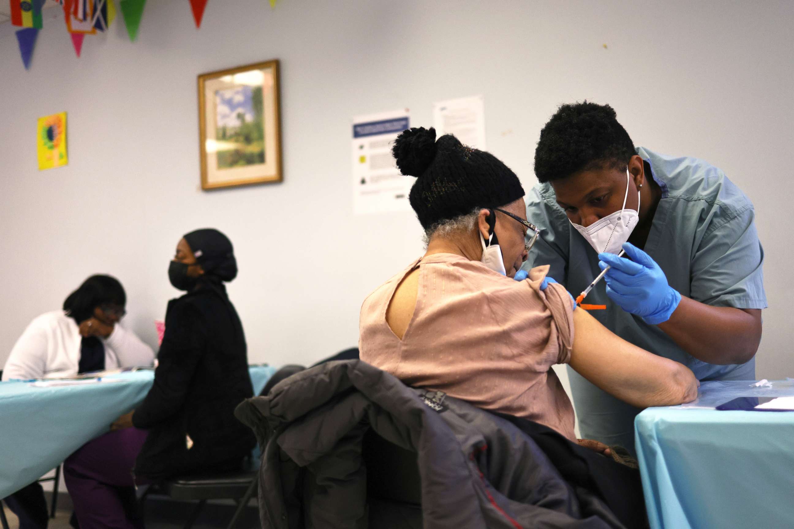 PHOTO: Elizabeth Griffin, 86, is given a dose of the Moderna coronavirus vaccine at Red Hook Neighborhood Senior Center in the Red Hood neighborhood of the Brooklyn borough of New York, Feb. 22, 2021.