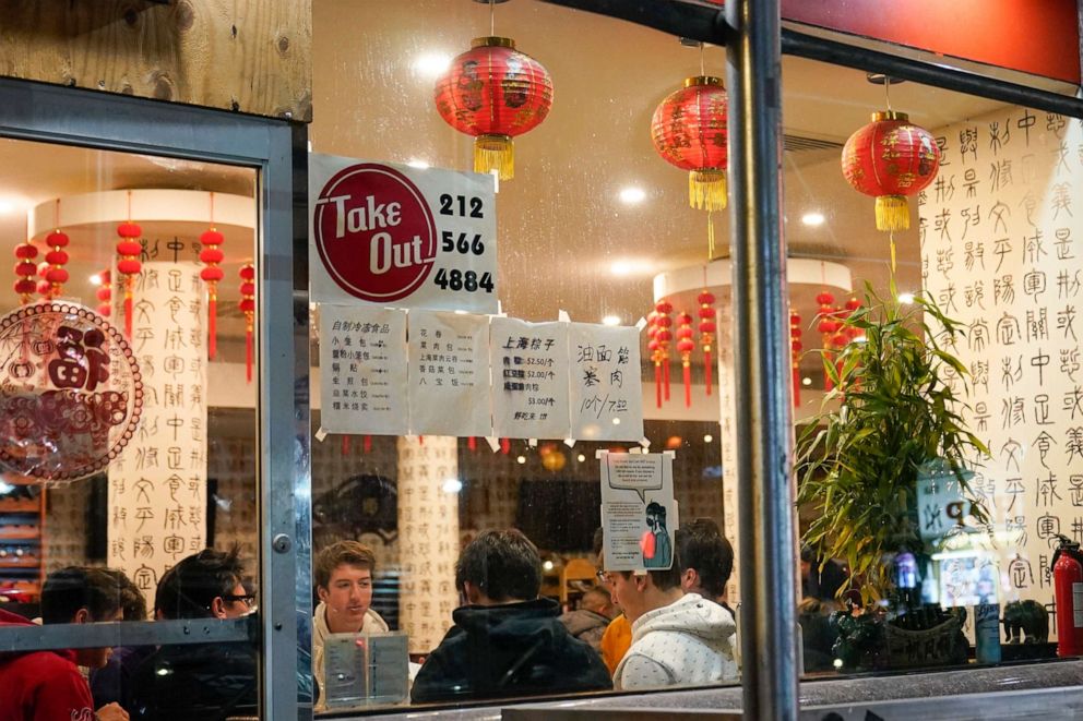 PHOTO: People eat inside the New Shanghai Deluxe restaurant as indoor dining resumes in the Chinatown neighborhood of New York, Feb. 12, 2021.