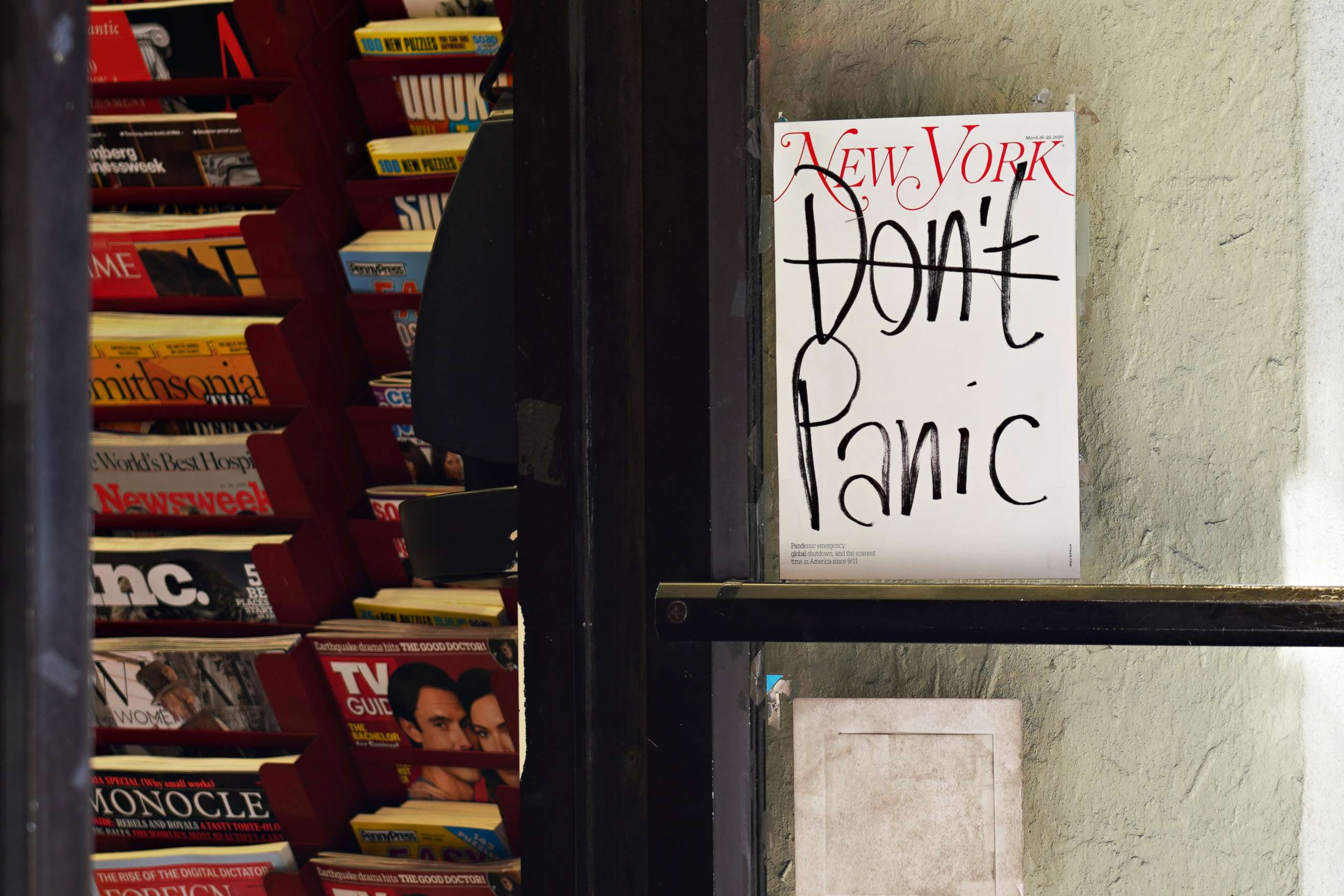 PHOTO: NEW YORK,  - MARCH 15: A New York Magazine cover reading 'Don't Panic' is displayed on the door of a magazine shop as the coronavirus continues to spread across the United States on March 15, 2020 in New York City. 