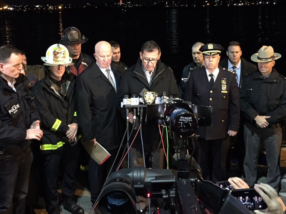 PHOTO: FDNY Commissioner Daniel Nigro, center, and NYPD Commissioner James O'Neill, to his right, hold a news conference after a helicopter crashed in the East River in Manhattan on March 11, 2018.