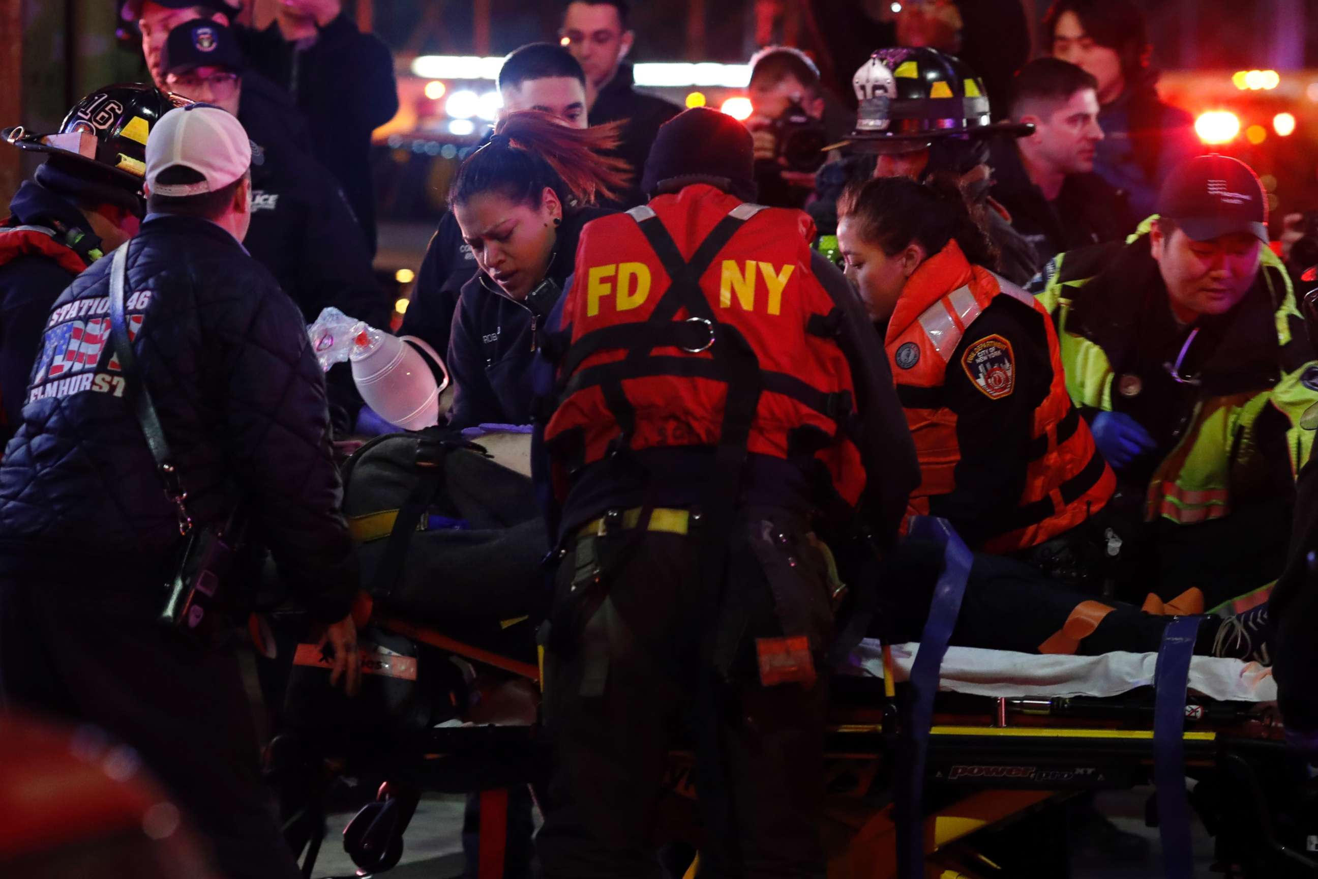 PHOTO: A helicopter crash victim is transferred by Fire Department officers at 34th Street Ferry Terminal in Manhattan, March 11, 2018.