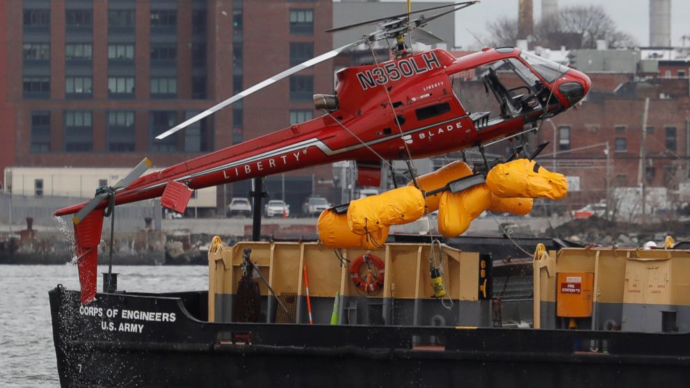 PHOTO: The wreckage of a chartered Liberty Helicopters helicopter that crashed into the East River is hoisted from the water in New York, March 12, 2018.