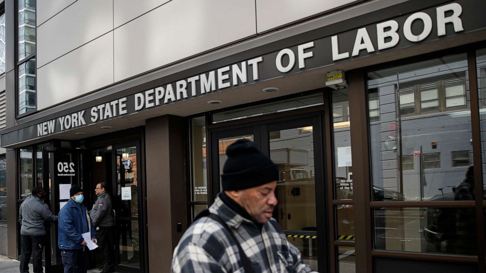 PHOTO: Visitors to the Department of Labor are turned away at the door by personnel due to closures over coronavirus concerns, Wednesday, March 18, 2020, in New York.