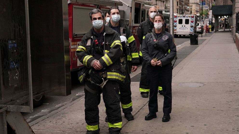 PHOTO: FDNY firefighters show gratitude to medical and frontline workers at Lenox Hill Hospital during the coronavirus pandemic, May 17, 2020, in New York City.