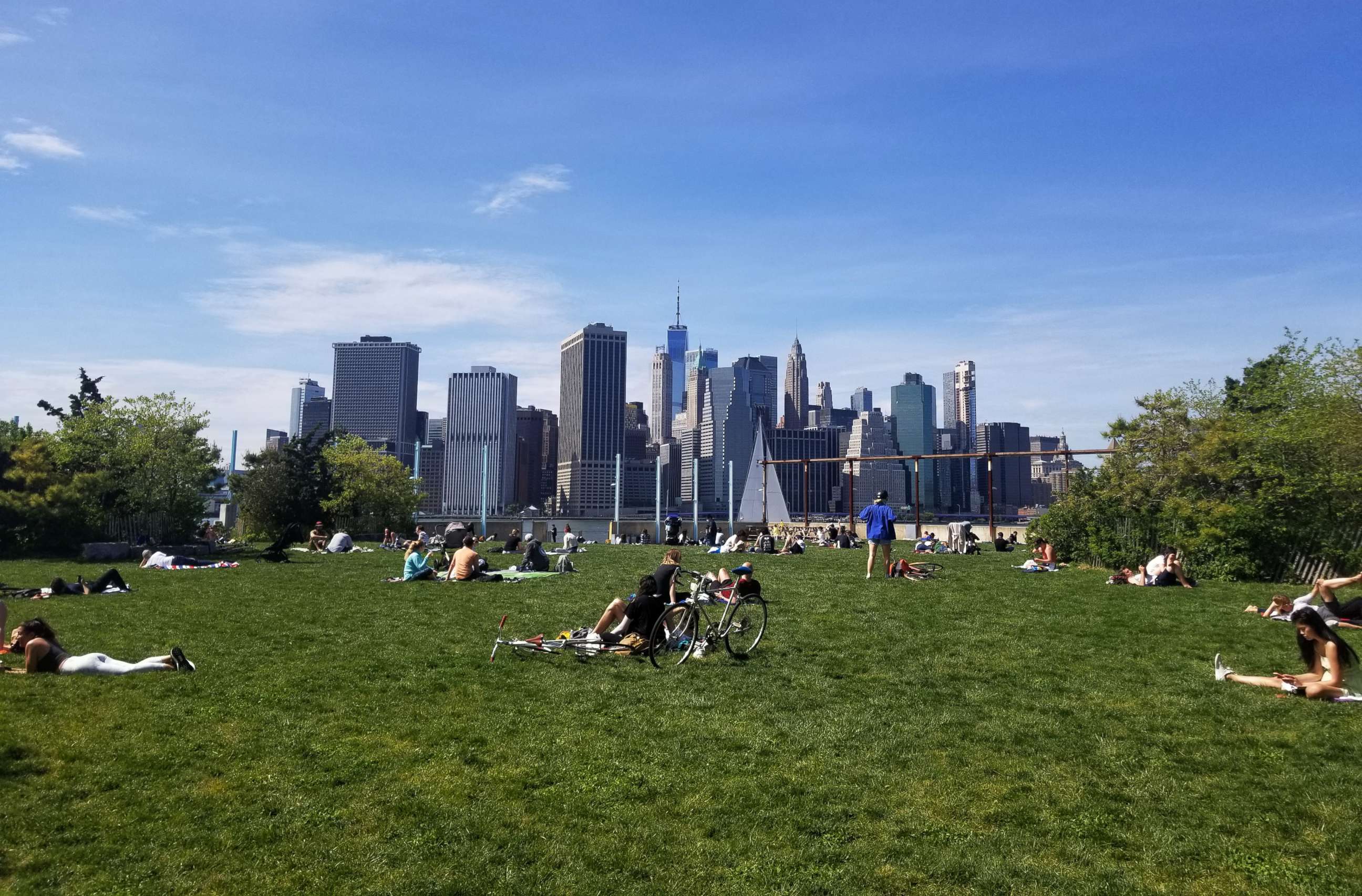PHOTO: People enjoy a spring day at the Brooklyn Bridge Park Pier 6 during the coronavirus pandemic on May 17, 2020 in Brooklyn, New York.
