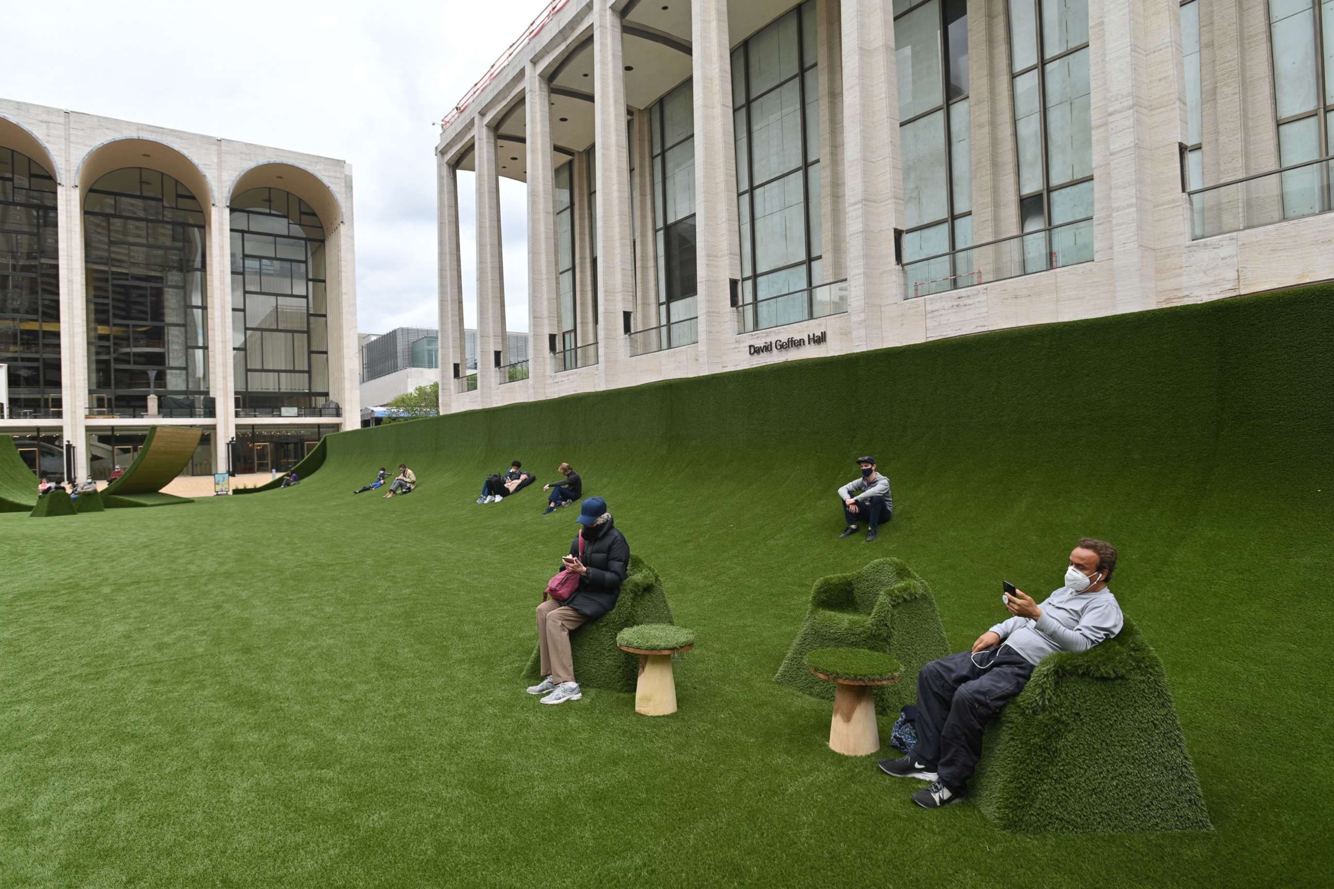 PHOTO: People wear masks at 'The Green' at Lincoln Center for the Performing Arts in New York, May 10, 2021.