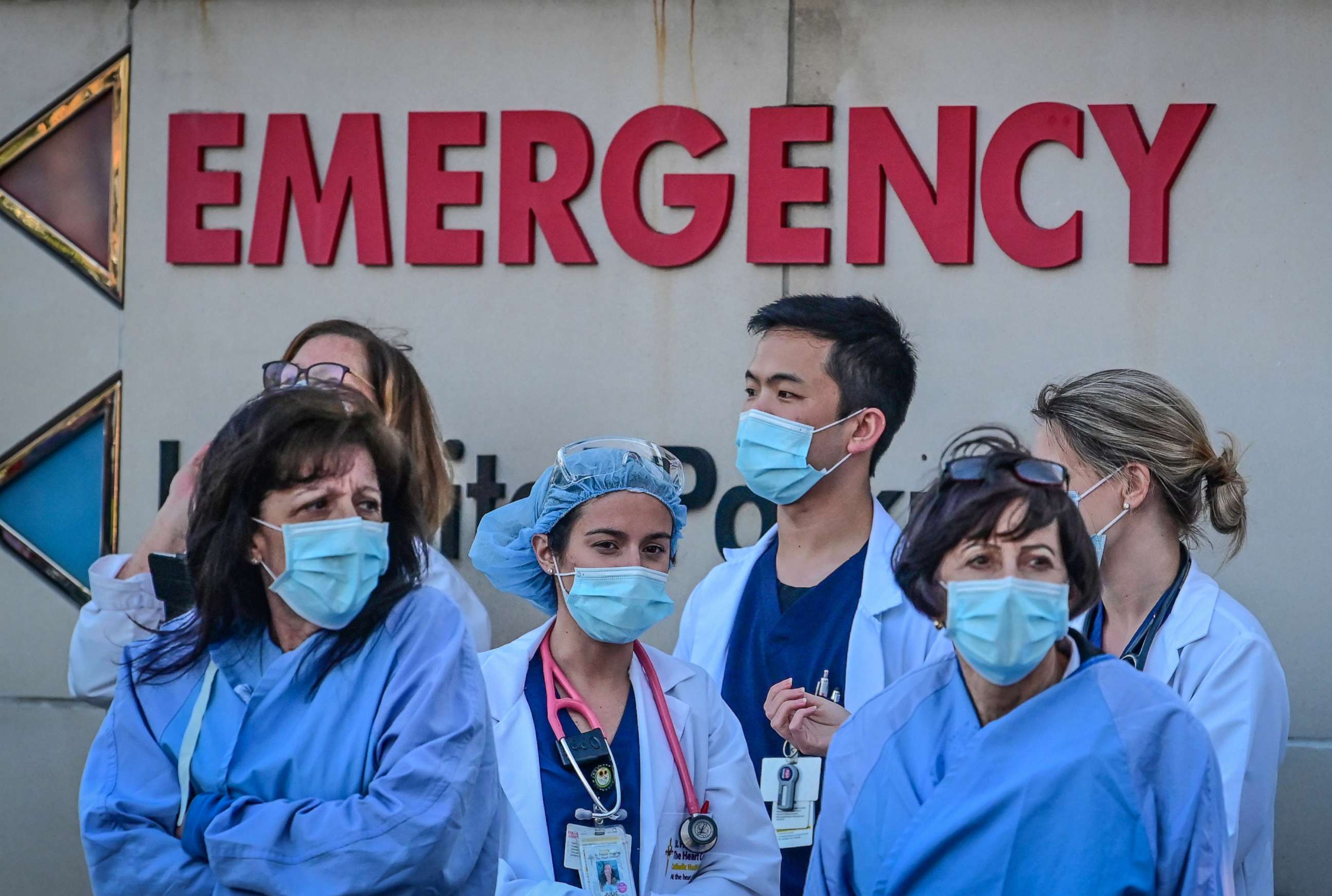 PHOTO: In this April 9, 2020, file photo, healthcare workers gather in front of St. Francis Hospital in Roslyn, New York.