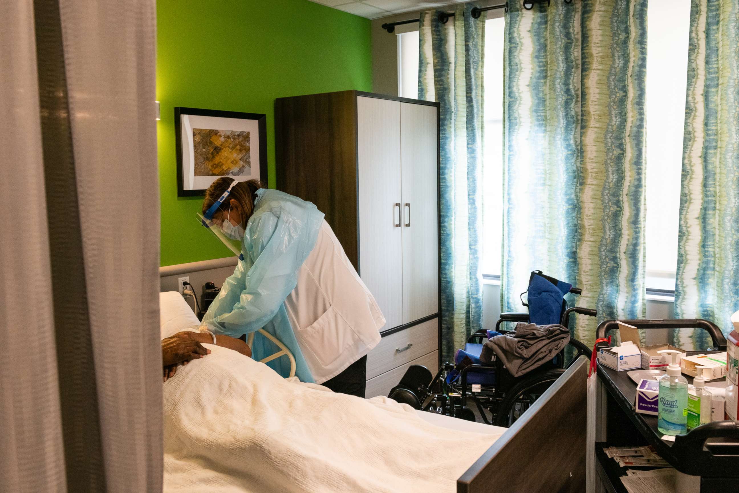 PHOTO: A pharmacist administers a dose of the COVID-19 vaccine to a resident of a nursing home in the Brooklyn borough of New York, Jan. 5, 2021.