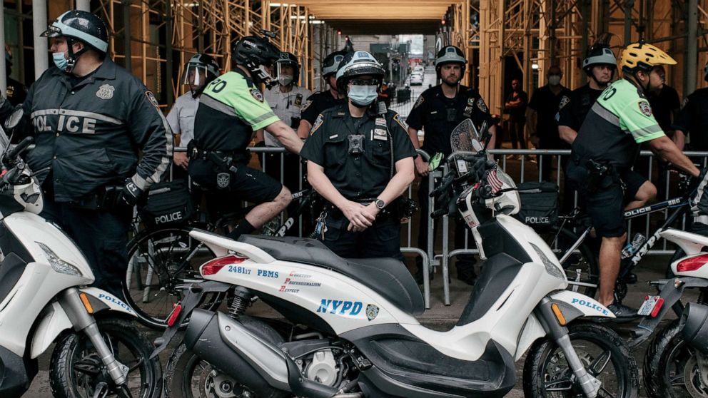 PHOTO: NYPD officers stand by as a march against police brutality proceeds through Lower Manhattan on June 11, 2020, in New York.