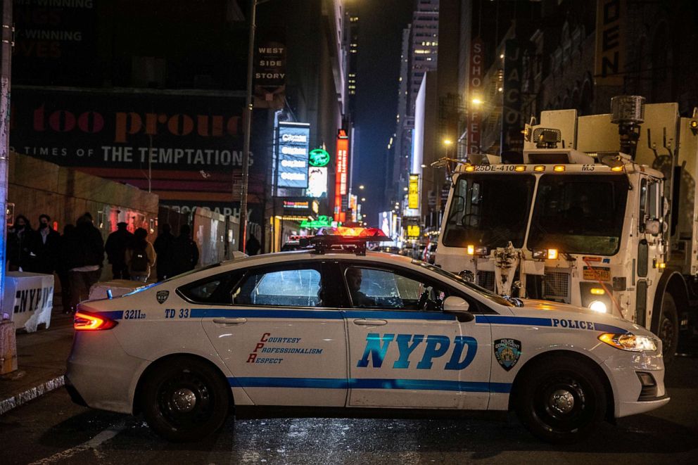 PHOTO: An NYPD police vehicle blocks the street during the virtual New Year's Eve event following the outbreak of the coronavirus disease in the Manhattan borough of New York, Dec. 31, 2020.