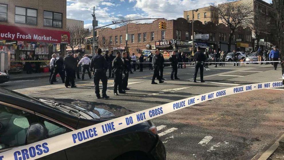 PHOTO: Police officers stand behind a cordon tape at the scene where New York police officers shot to death a black man who pointed a metal pipe at them, in the borough of Brooklyn, N.Y., April 4, 2018, in this picture obtained from social media.