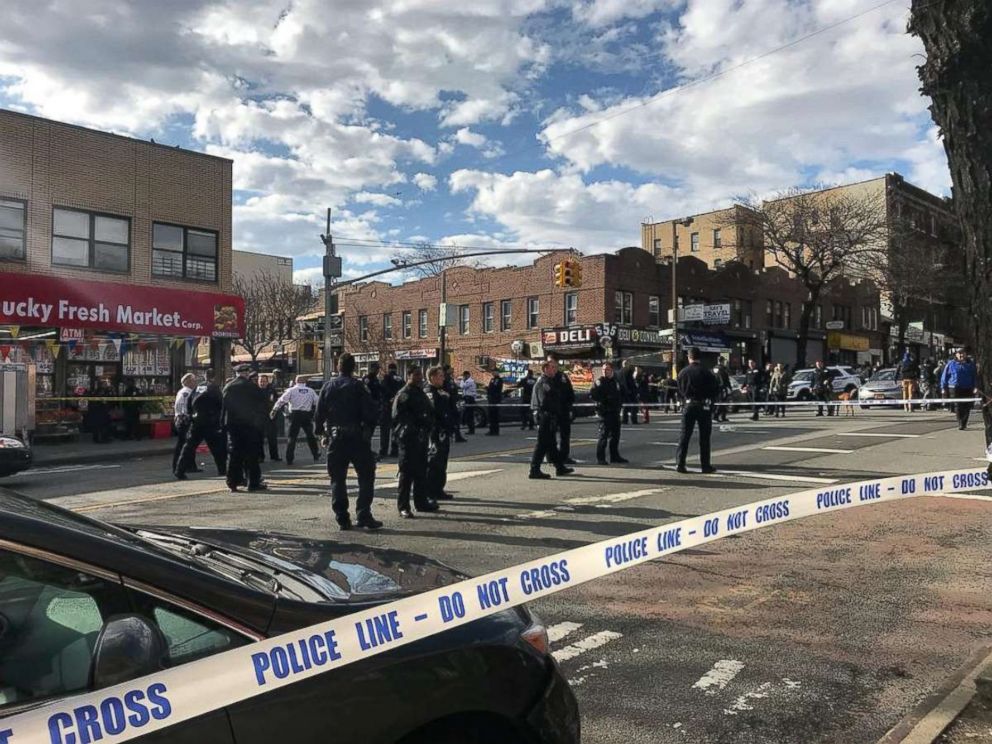 PHOTO: Police officers stand behind a cordon tape at the scene where New York police officers shot to death a black man who pointed a metal pipe at them, in the borough of Brooklyn, N.Y., April 4, 2018, in this picture obtained from social media.