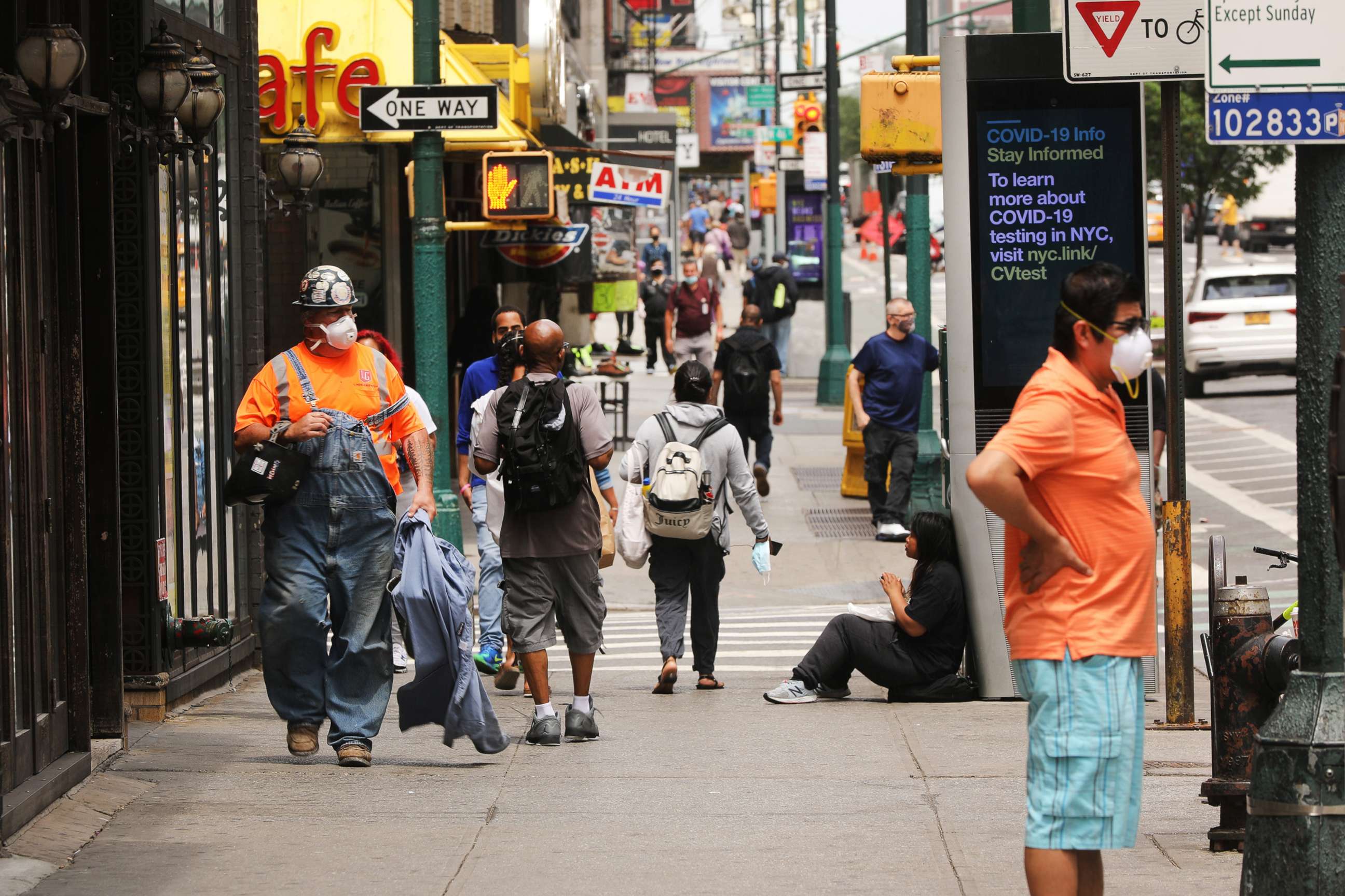 PHOTO: People walk through Manhattan on June 18, 2020, as the city prepares to enter stage 2 of reopening this coming Monday in New York.