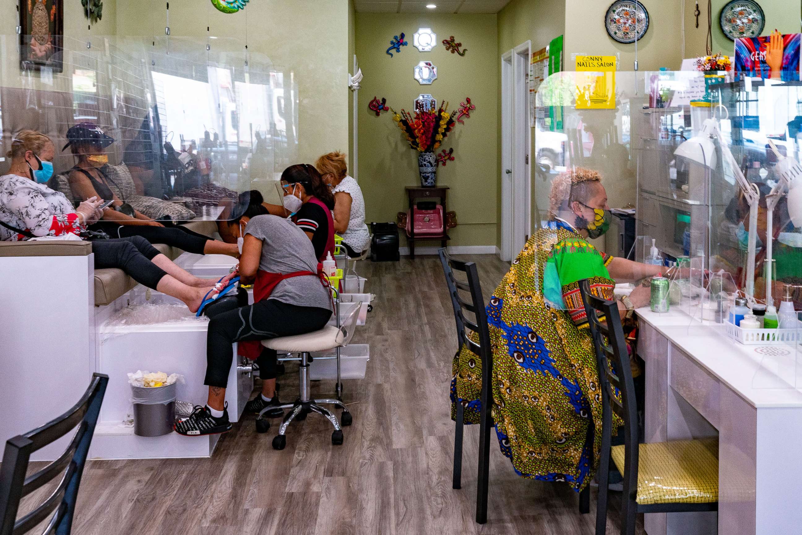 PHOTO: Customers have their nails done at Conny Nail Salon on July 6, 2020, in New York.