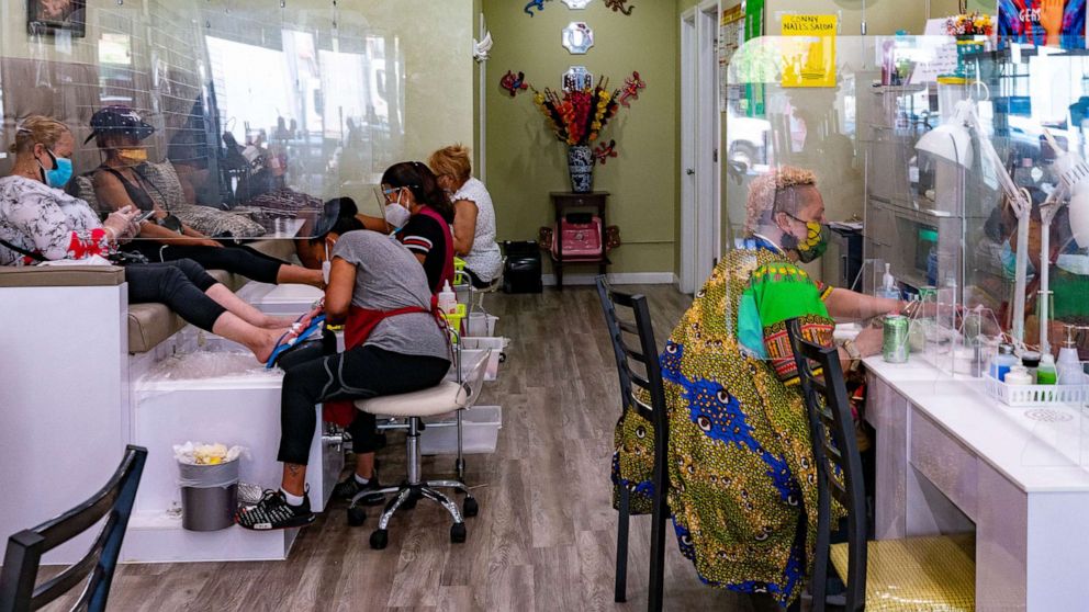 PHOTO: Customers have their nails done at Conny Nail Salon on July 6, 2020, in New York.