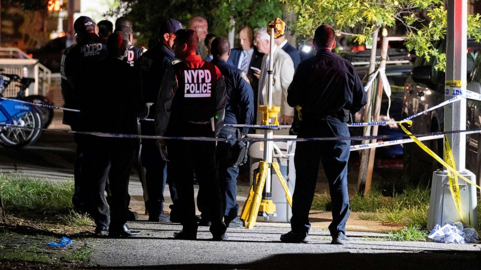 PHOTO: Police investigators at the scene of the fatal shooting of a 20-year-old woman on the Upper East Side of Manhattan, on June 29, 2022.