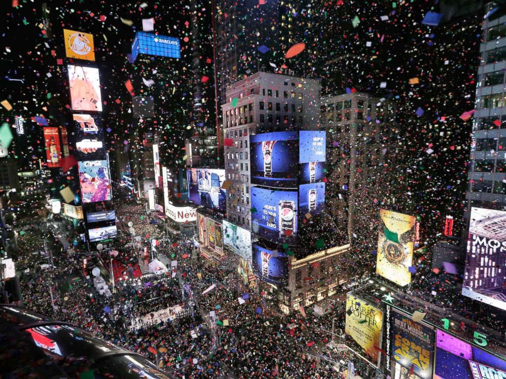 PHOTO: Confetti drops over the crowd as the clock strikes midnight during the New Years celebration in Times Square, New York, Jan. 1, 2018.