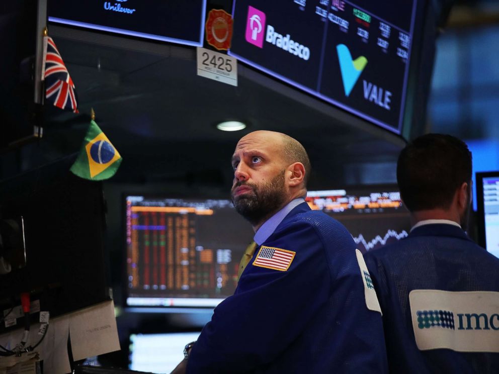 PHOTO: Traders work on the floor of the New York Stock Exchange moments before the closing bell on Feb. 8, 2018 in New York.