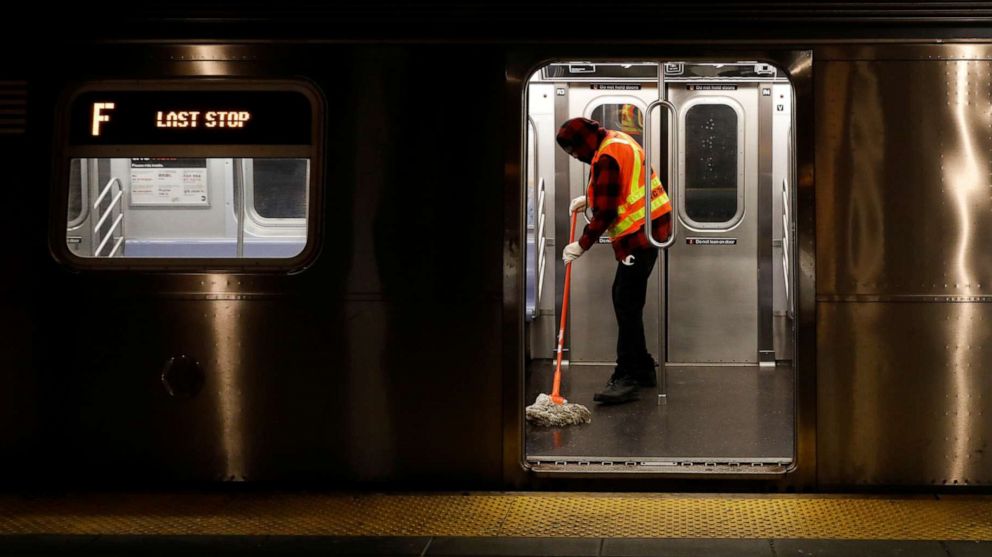PHOTO: A worker mops the floor as the MTA Subway closed overnight for cleaning and disinfecting during the outbreak of the coronavirus disease in the Brooklyn borough of New York, May 7, 2020.