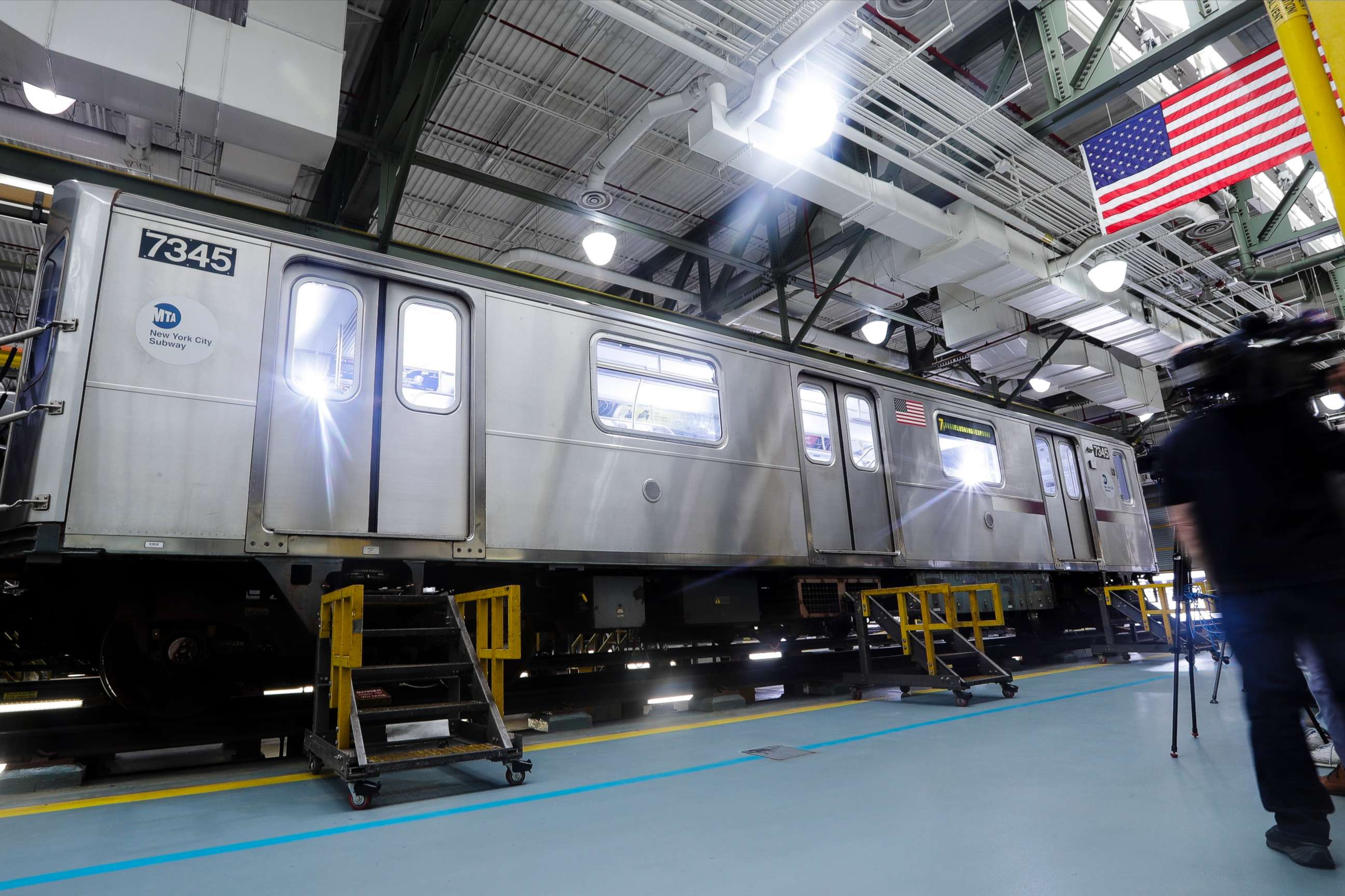 PHOTO: Members of the media witness a demonstration of new measures involving UV-C light technology to disinfect a subway car during the coronavirus pandemic at the Corona Maintenance Facility, May 19, 2020, in the Queens borough of New York.