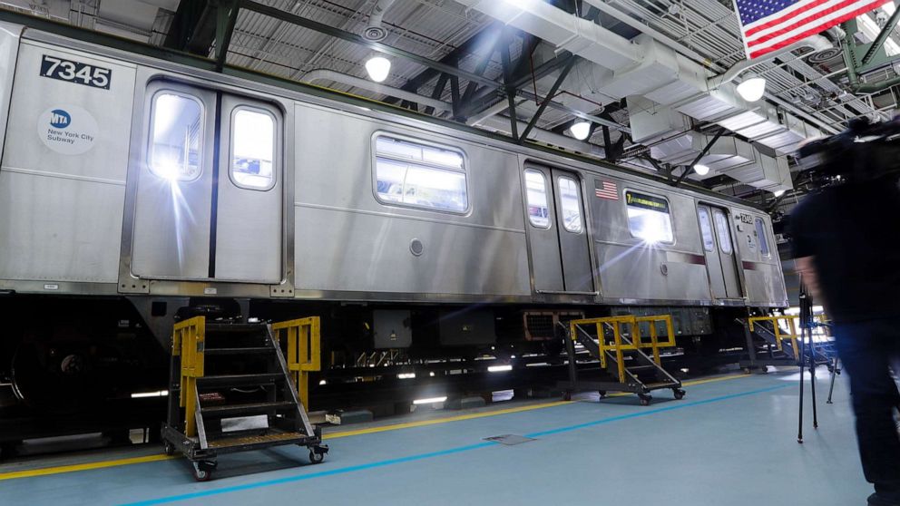 PHOTO: Members of the media witness a demonstration of new measures involving UV-C light technology to disinfect a subway car during the coronavirus pandemic at the Corona Maintenance Facility, May 19, 2020, in the Queens borough of New York.