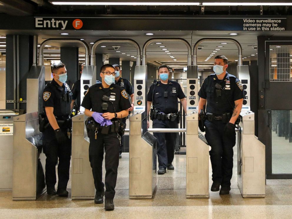 PHOTO: New York Police officers patrol around Times Square subway station on May 15, 2020 in New York City.  