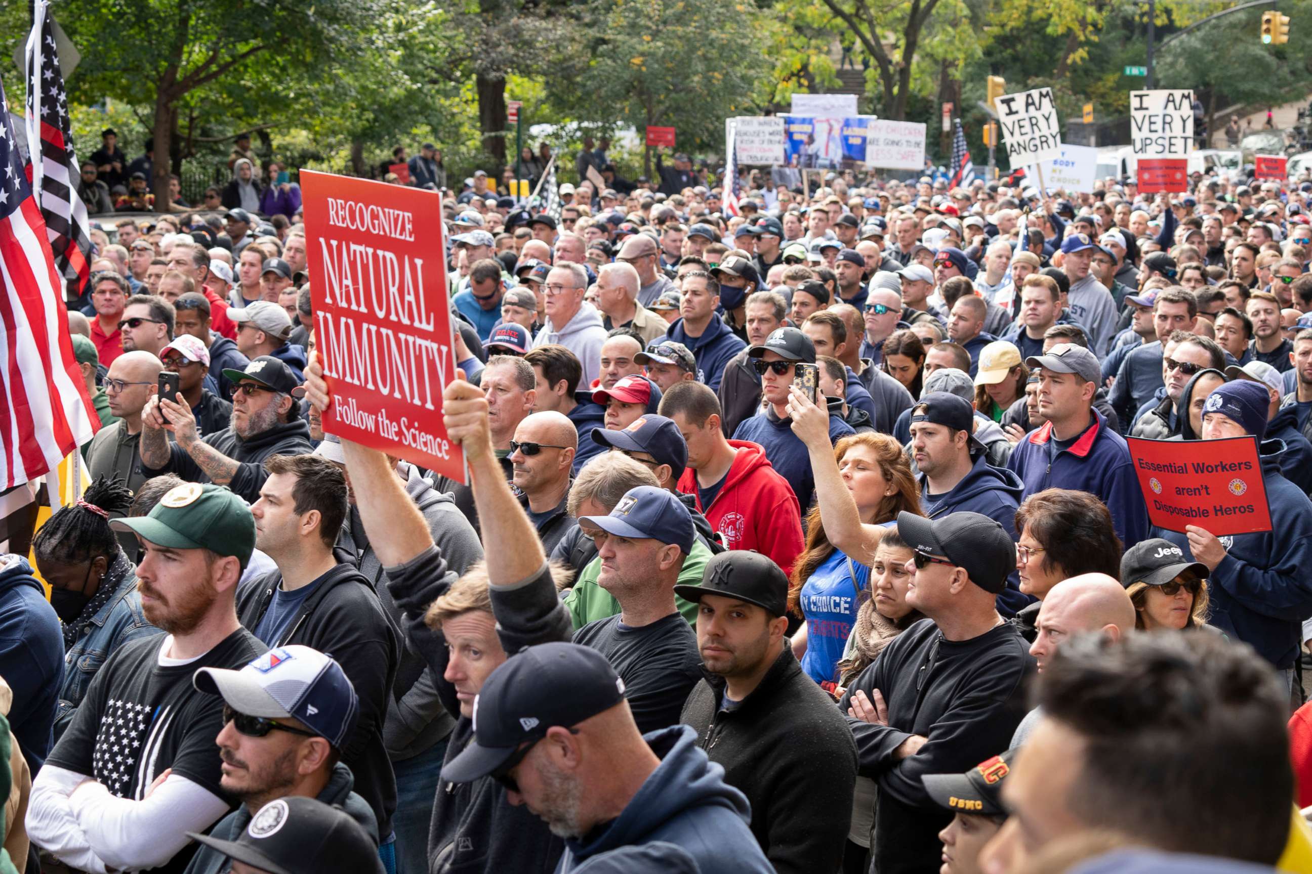 PHOTO: New York Fire Department employees and others protest outside Gracie Mansion, the official residence of the mayor, in New York on Oct. 28, 2021, to protest the mandate almost every municipal worker be vaccinated against COVID-19.