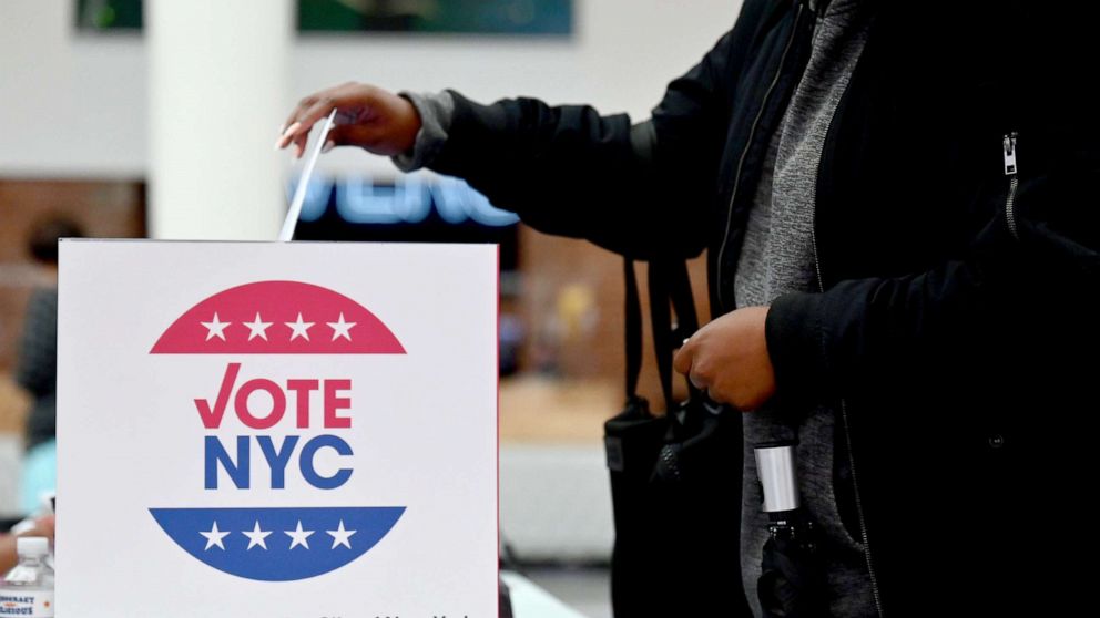 PHOTO: A voter drops off her early voting ballot at the Brooklyn Museum in New York, Oct. 30, 2020.