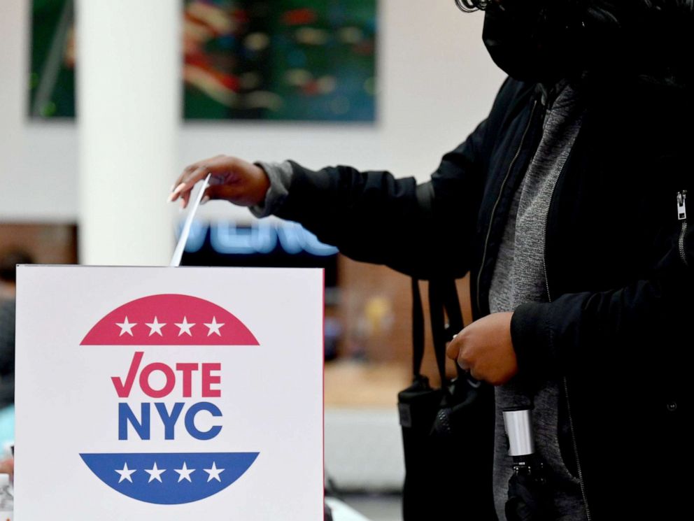PHOTO: A voter drops off her early voting ballot at the Brooklyn Museum in New York, Oct. 30, 2020.