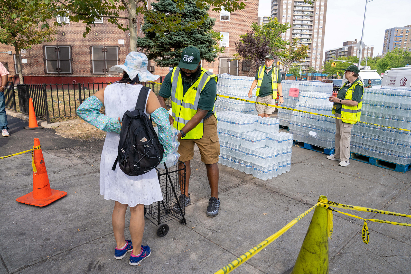 PHOTO: Residents of NYCHA Jacob Riis Houses were seen filling bottles from NYC DEP water stations or collecting bottled water at Avenue D and East 10th Street in New York, on Sept. 4, 2022.