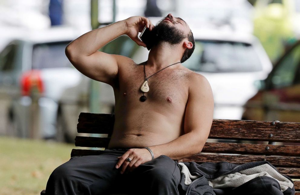 PHOTO: A man reacts as he speaks on a mobile phone outside a mosque in central Christchurch, New Zealand, March 15, 2019.