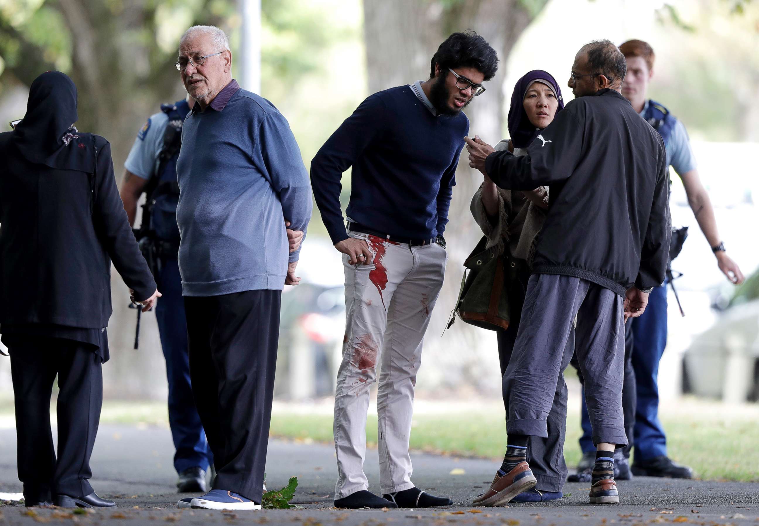 PHOTO: People stand across the road from a mosque in central Christchurch, New Zealand, March 15, 2019.