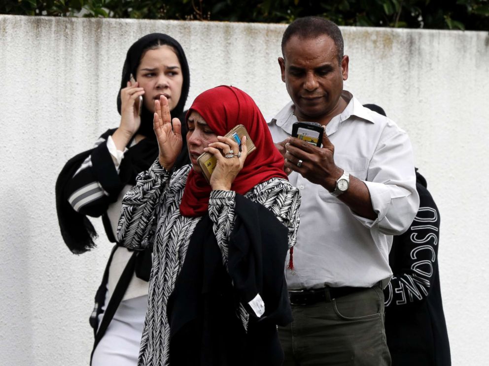 PHOTO: People wait outside a mosque in central Christchurch, New Zealand, March 15, 2019.