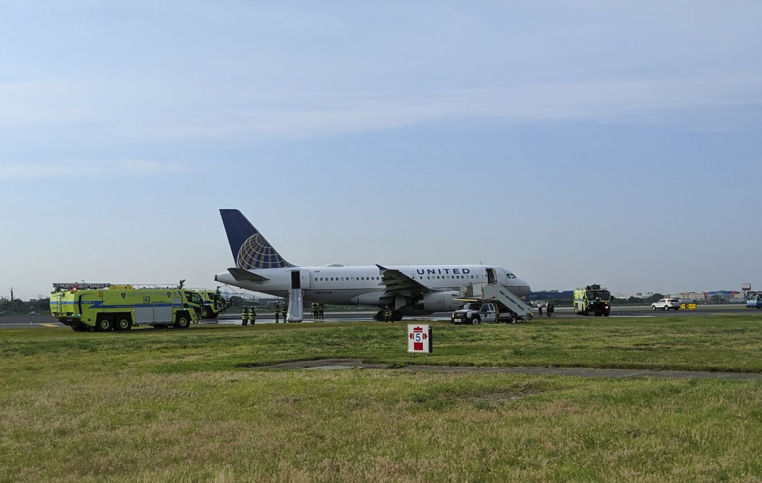 PHOTO: This photo provided by John Murray shows a United flight sitting on the runway after making an emergency landing on June 29, 2019 at Newark Liberty Airport in Newark, N.J.