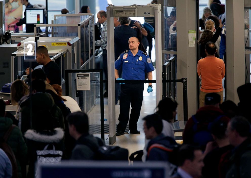 PHOTO: Transportation Security Administration agents help passengers through a security checkpoint at Newark Liberty International Airport in Newark, N.J., Jan. 7, 2019.