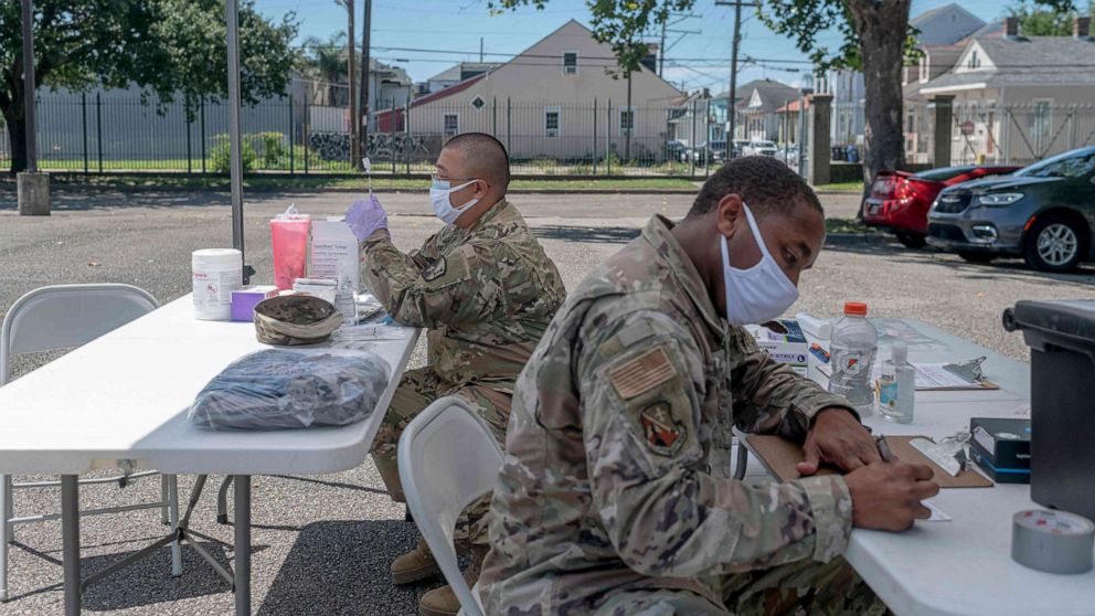 PHOTO: National Guard work at a vaccine clinic in New Orleans on Aug. 14, 2021 as Louisiana Governor John Bel Edwards ordered an indoor mask mandate amid COVID-19 surge.