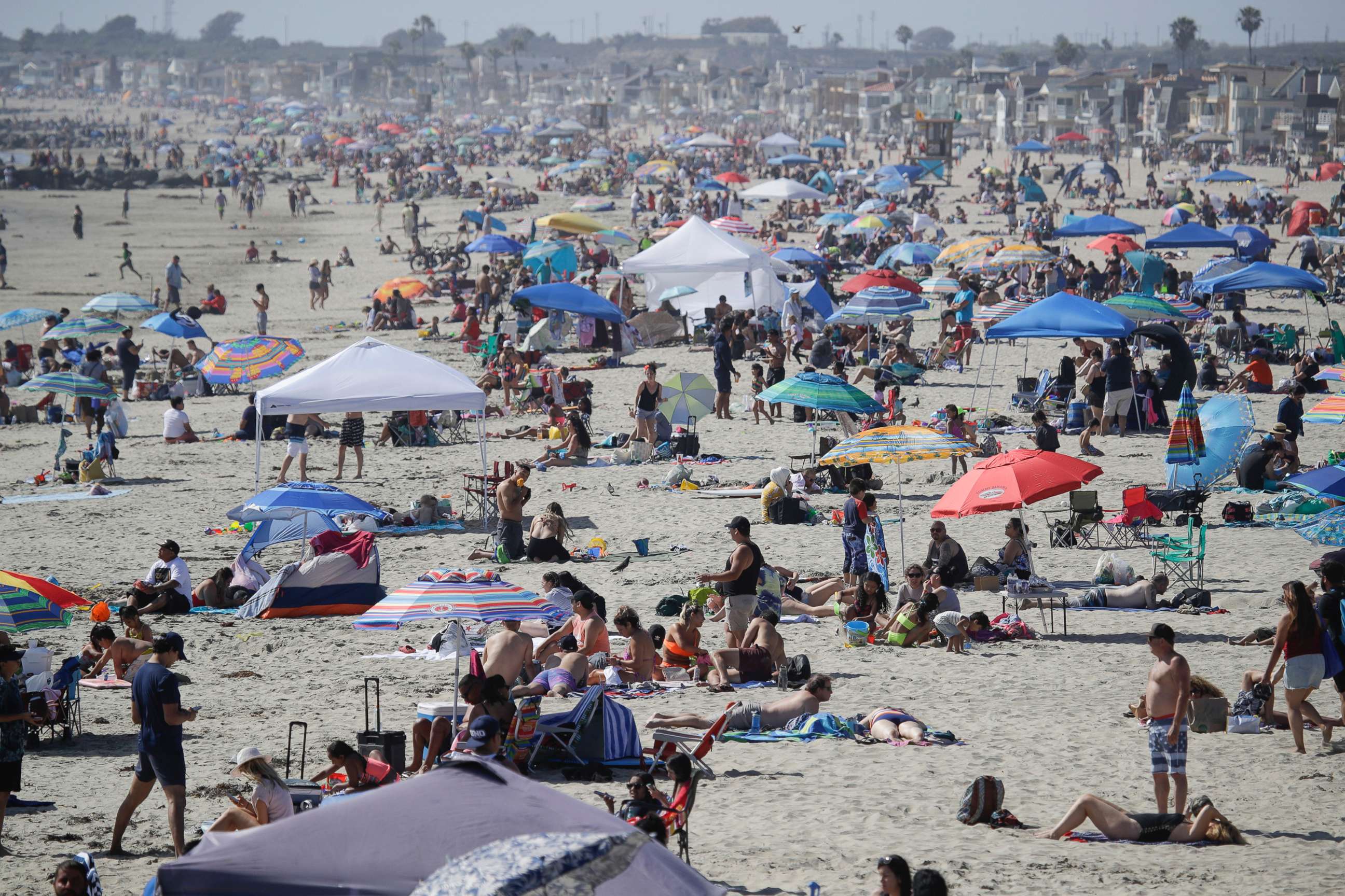 PHOTO: In this May 24, 2020, file photo, people gather on the beach during the Memorial Day weekend in Newport Beach, Calif.