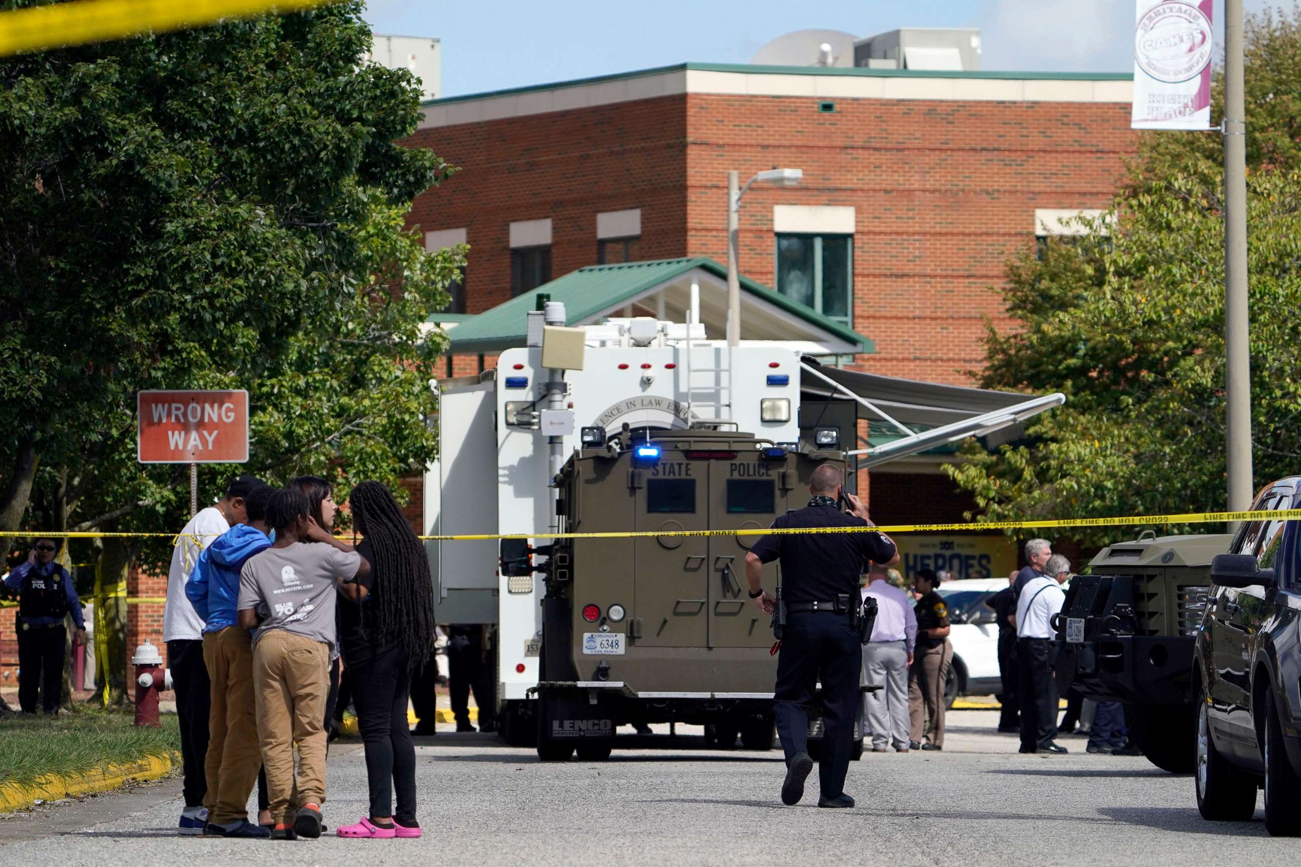 PHOTO: Police and other security personnel outside Heritage High School after two students were injured in a shooting, Sept. 20, 2021, in Newport News, Va.