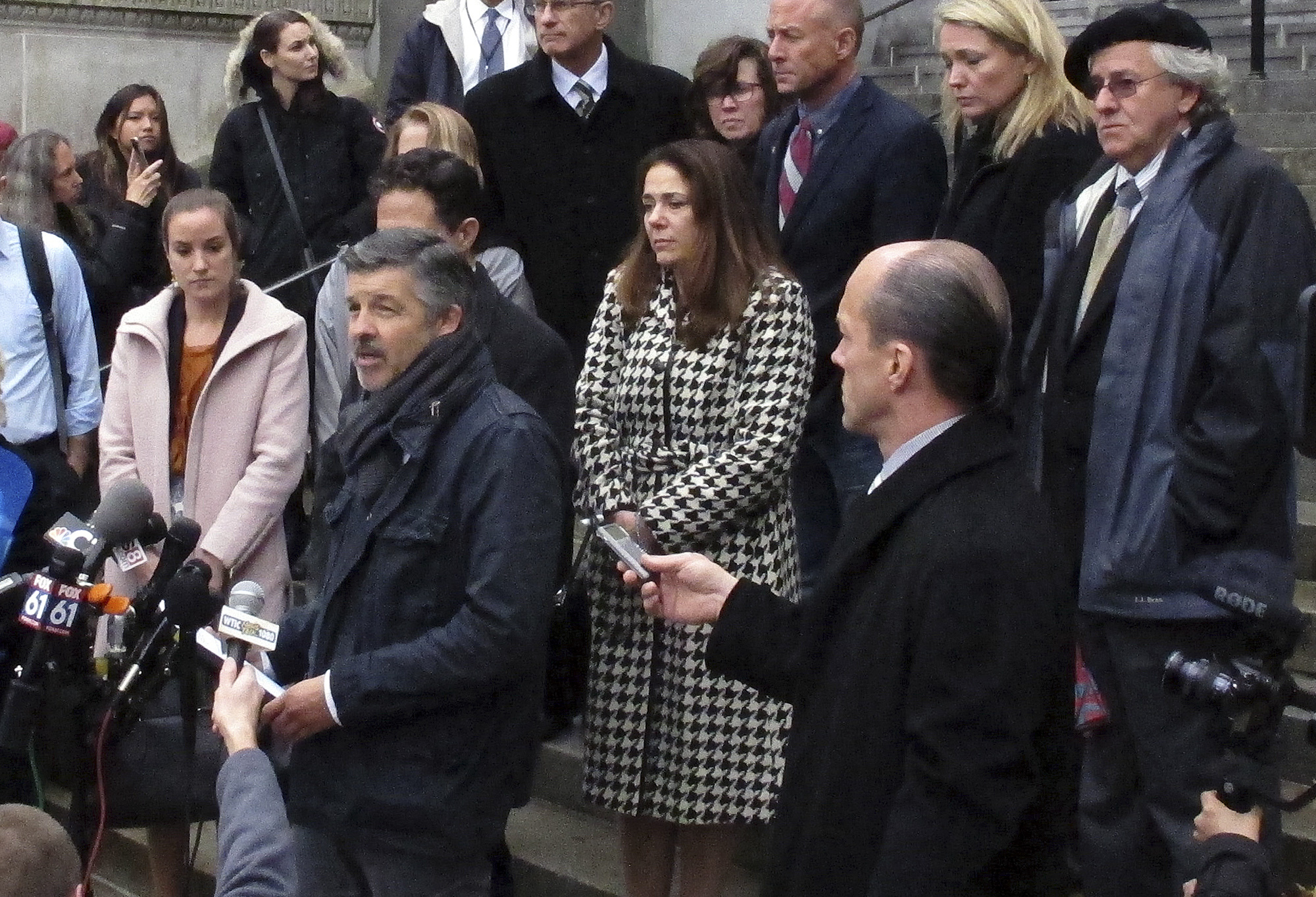 PHOTO: Ian Hockley, front left, father of Dylan Hockley, one of the children killed in the 2012 Sandy Hook Elementary School shooting, speaks outside the Connecticut Supreme Court, Nov. 14, 2017, in Hartford, Conn. 