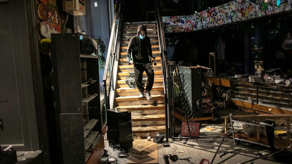 PHOTO: A man takes skateboards during a night of protests and vandalism over the death of George Floyd on June 1, 2020 in New York City.