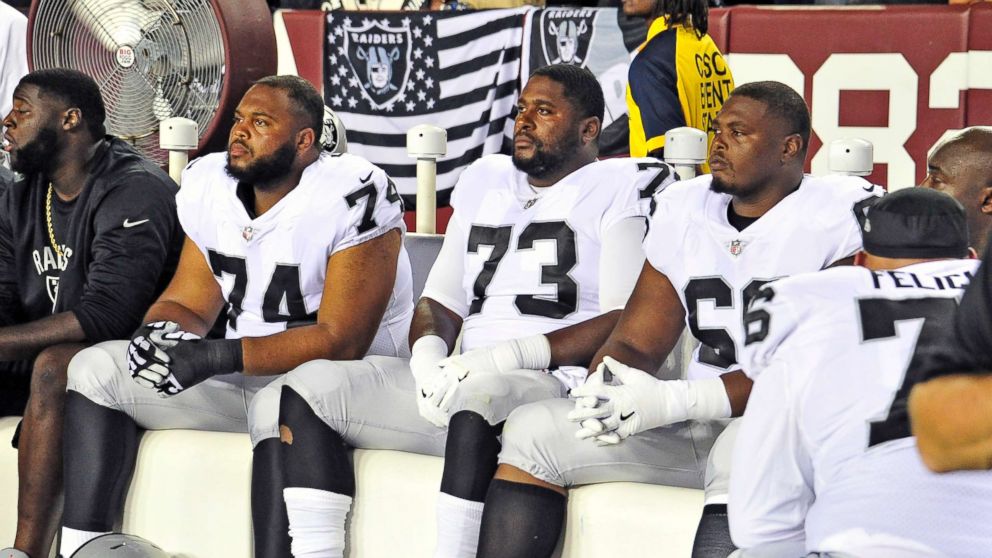 PHOTO: Oakland Raiders sit on the bench and stare straight ahead as the national anthem is sung prior to the game against the Washington Redskins at FedEx Field, Sept. 24, 2017,in Landover, Md. 