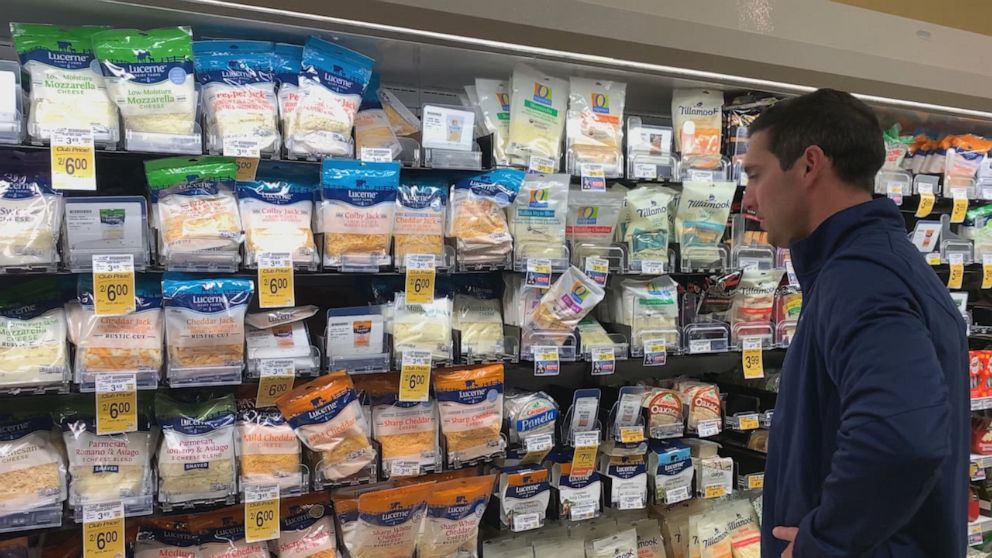 PHOTO: Nick Stanford has to choose what groceries to buy for his family.