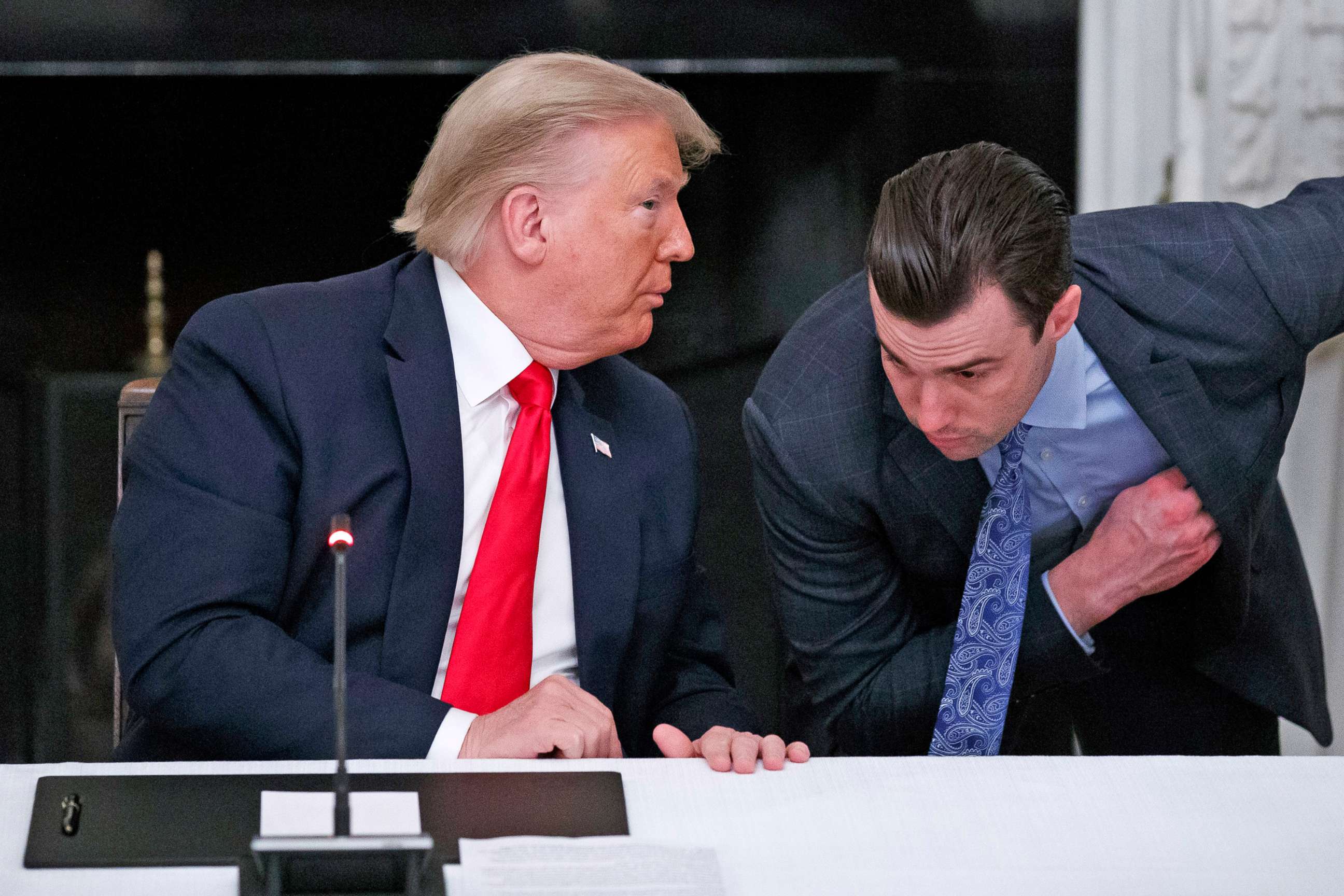PHOTO: President Donald Trump speaks to White House special assistant to the president Nick Luna, during a roundtable with governors on the reopening of America's small businesses, at the White House, June 18, 2020.
