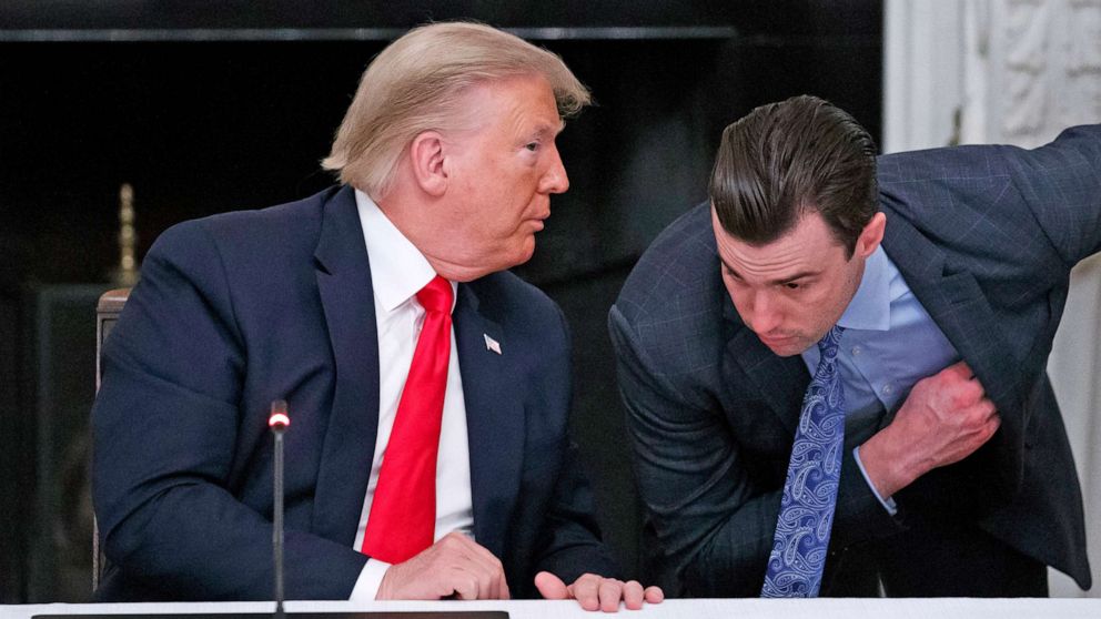 PHOTO: President Donald Trump speaks to White House special assistant to the president Nick Luna, during a roundtable with governors on the reopening of America's small businesses, at the White House, June 18, 2020.