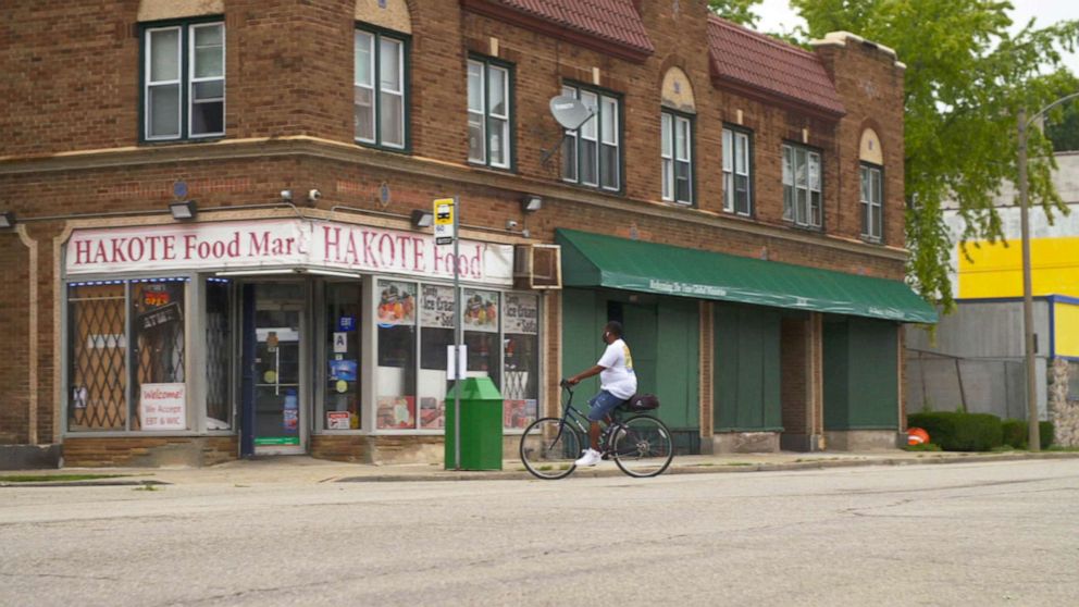 PHOTO: A resident bicycles past a store in Milwaukee, Wisconsin, in an image from ABC News' "Nightline," Feb. 9, 2022.
