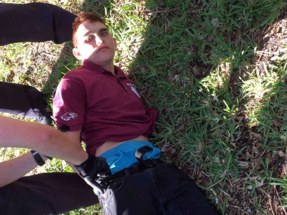 PHOTO: Nikolas Cruz is placed into handcuffs by police near Marjory Stoneman Douglas High School following a mass shooting in Parkland, Fla., Feb. 14, 2018.