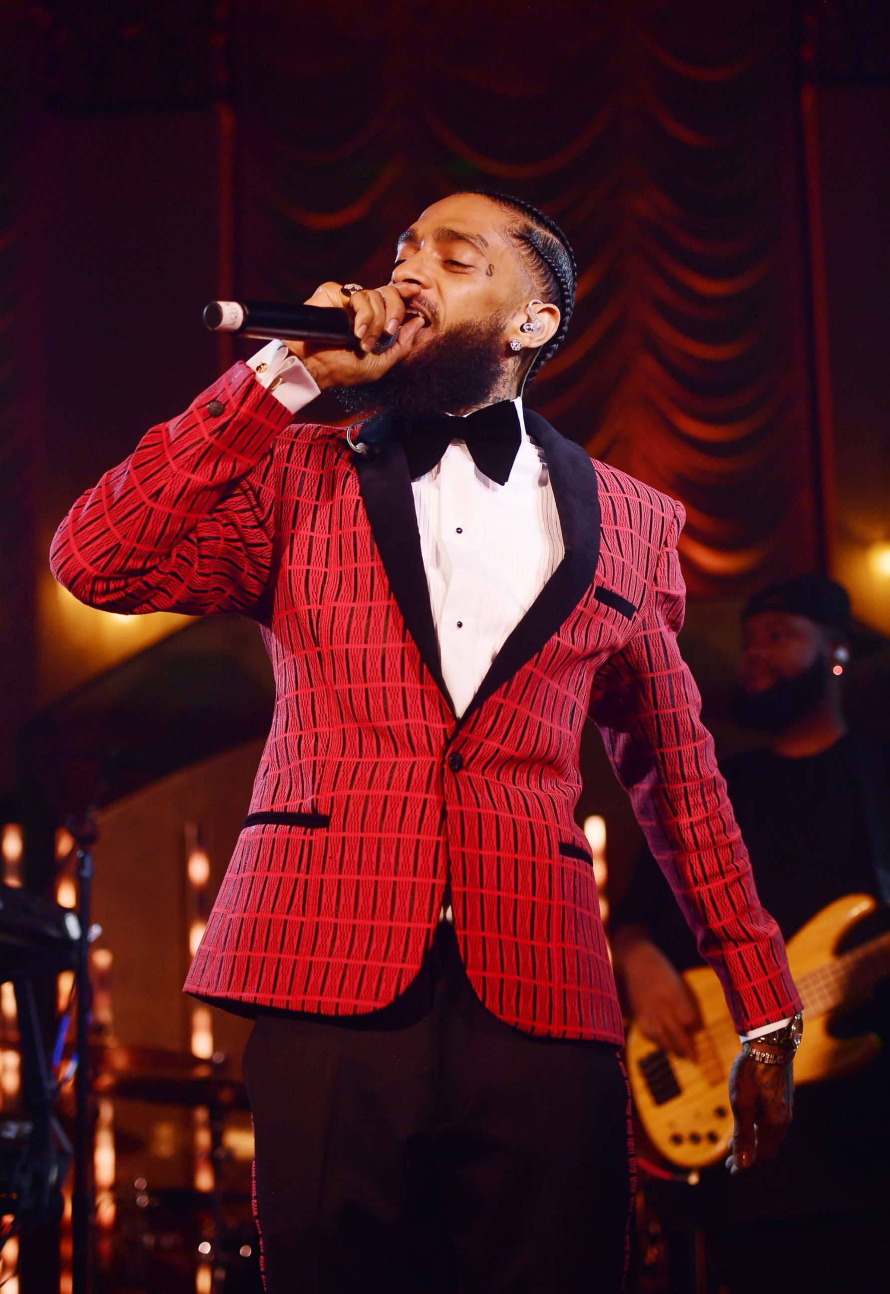 PHOTO: In this Feb. 7, 2019, file photo, Nipsey Hussle performs onstage at the Warner Music Pre-Grammy Party at the NoMad Hotel in Los Angeles.