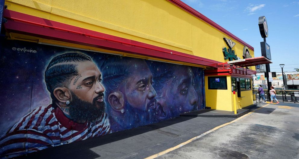 PHOTO: A street mural of the late rapper Nipsey Hussle is pictured near his closed Marathon Clothing store, June 30, 2022, in Los Angeles.