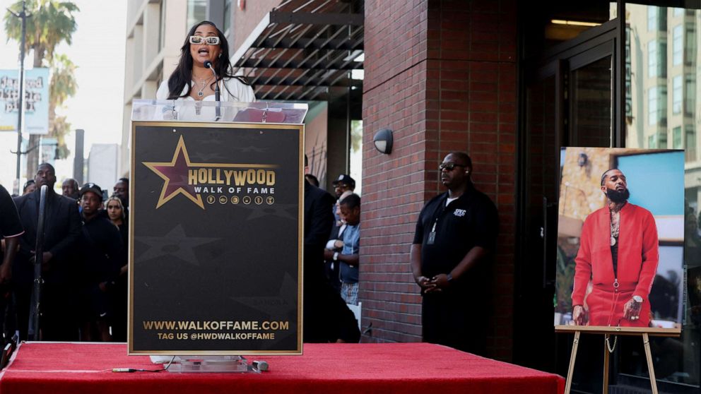 PHOTO: Lauren London, partner of late Nipsey Hussle, speaks during the unveiling of his star as he is honored posthumously on the Hollywood Walk of Fame in Los Angeles, Aug. 15, 2022.